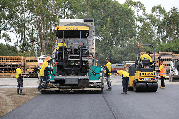 Bomag paver and bomag roller in use on asphalt job with Pothole People Qld team