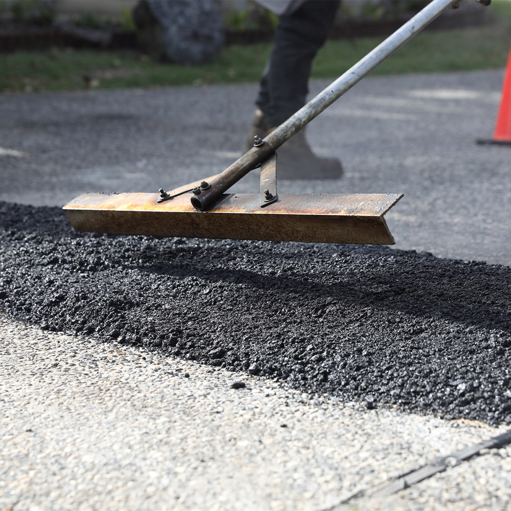 Laying asphalt on residential road